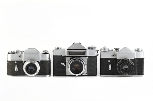 MOSCOW, RUSSIA, NOVEMBER 14, 2021. Very rare old Soviet 35 mm SLR camera Zenit-4, released 1967, Zenit 3, Zenit B released 1961 and 1968 , on white background.