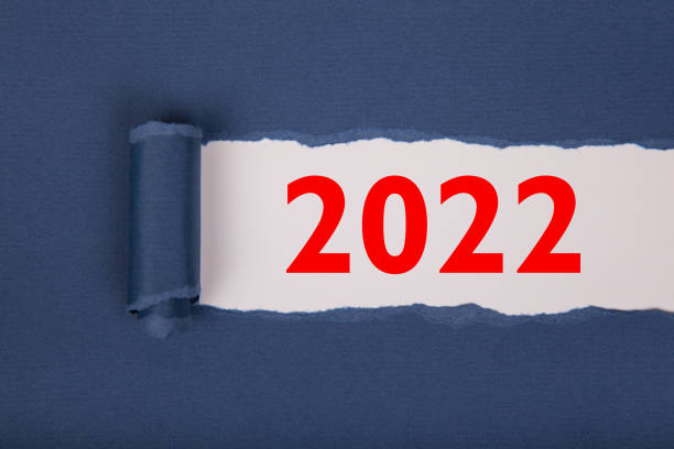 istock Torn Paper With Happy New Year 2022 On White Background 1353270485