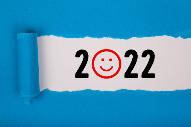 istock Torn Paper With Happy New Year 2022 On White Background 1353271405