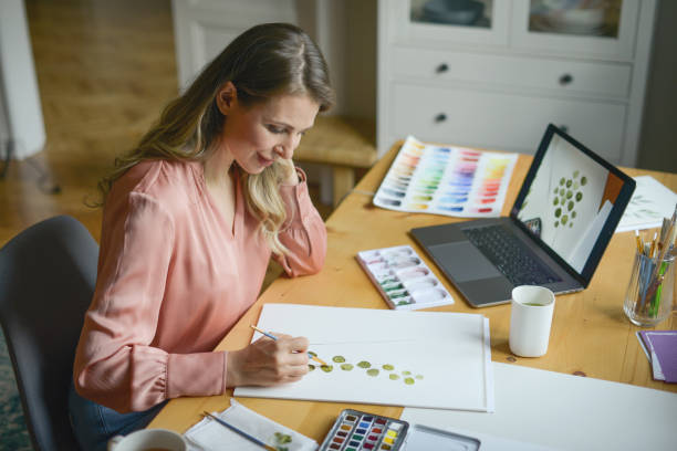 istock woman artist at work (with laptop) 1353272773