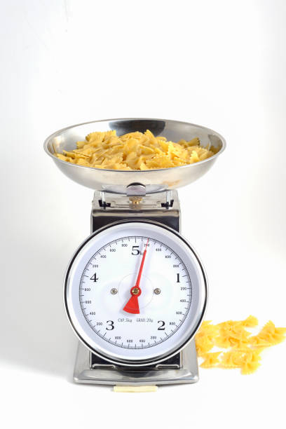 istock Pasta to be cooked weighed on the scales 1353273015