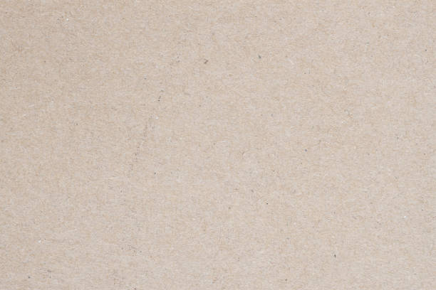 istock Natural craft paper texture, cardboard background close-up 1353281509