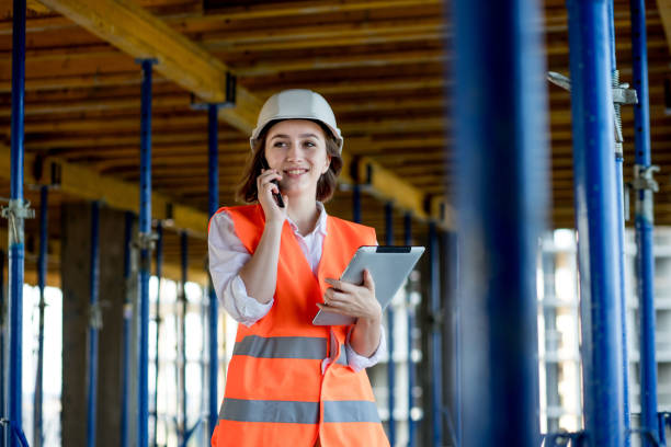 istock Construction concept of Engineer or Architect working at Construction Site. A woman with a tablet at a construction site. Bureau of Architecture 1353281688