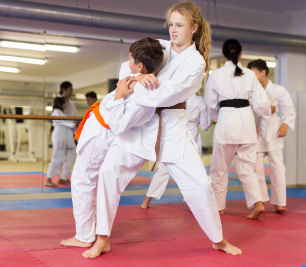 istock Karate kids training in gym 1353281895