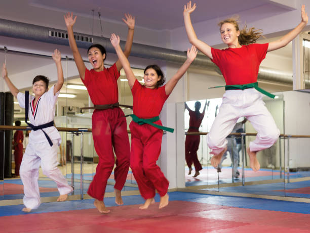 istock Children jumping with instructor at gym 1353281909