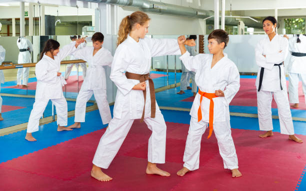 istock Kids on karate training in gym 1353282119