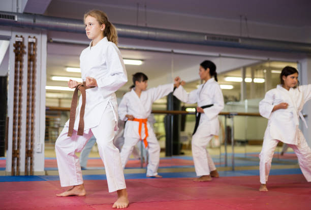 Girl standing in fighting stance during karate training