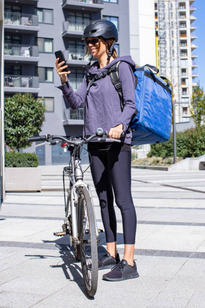 istock woman delivery person taking order 1353282373