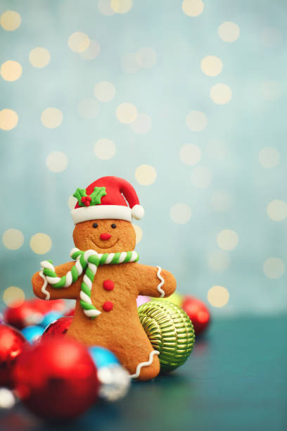 Christmas Background with Gingerbread Man Standing Amongst Christmas Decorations