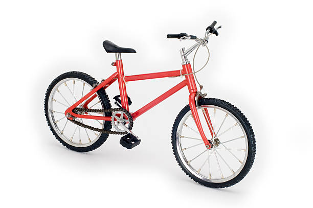 Scale model bicycle isolated on a white background. Shot from the front, side at a high angle.