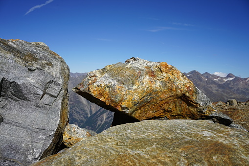 Cluster of rocks against the mountain background
