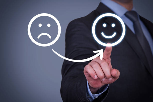 istock Human Hand Touching Unhappy and Happy on Touch Screen 1353289163
