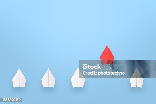 istock Change concepts with red paper airplane leading among white 1353290150