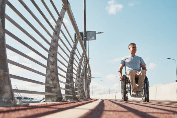 istock Smiling Man with Disability Enjoying Outdoors 1353290885