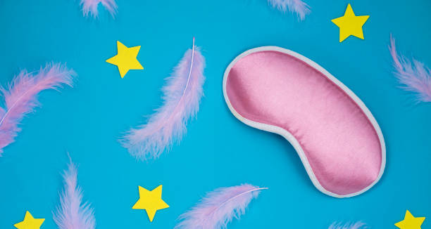 istock Paper background with the feathers, stars and sleeping mask 1353290953