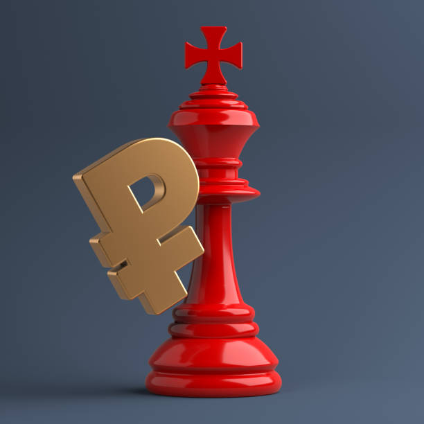 istock Red-colored king-chess piece and gold-colored Ruble symbol. 1353294590