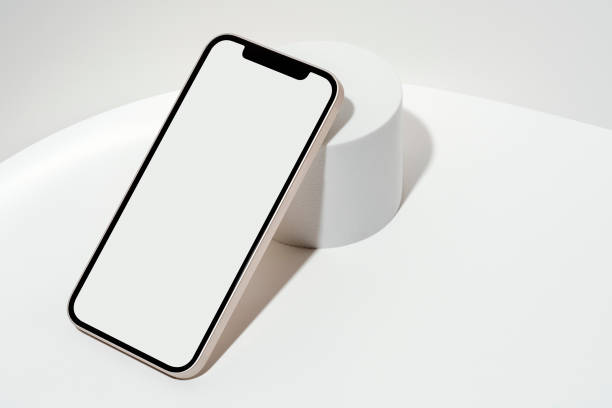 istock White blank screen smart phone mockup, template on geometric pedestal 1353295710