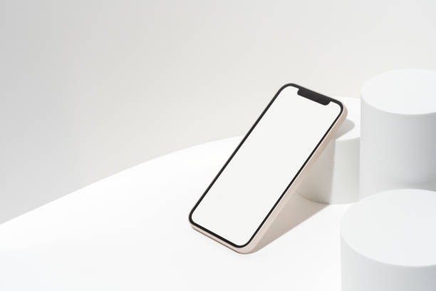istock White blank screen smart phone mockup, template on geometric pedestal 1353299305