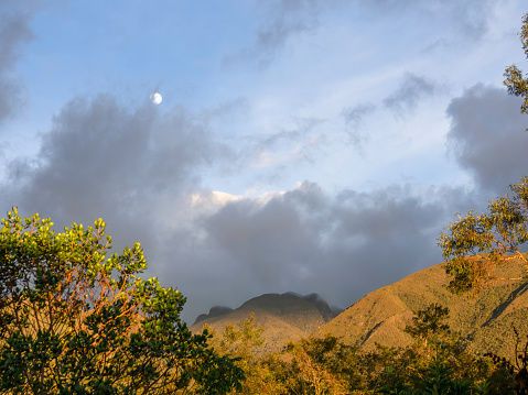 The Andean mountains with the moon at sunset near the town of Villa de Leyva in central Colombia.