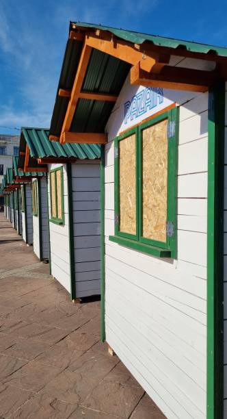 istock Row of identical wooden shops 1353301059
