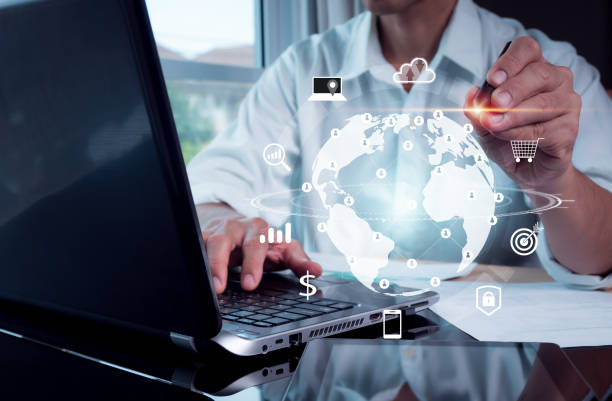 istock A man piont a virtual world on a laptop computer with an internet connection for the metaverse. Global marketing and banking financial transactions are routed through the application technology idea. 1353304650