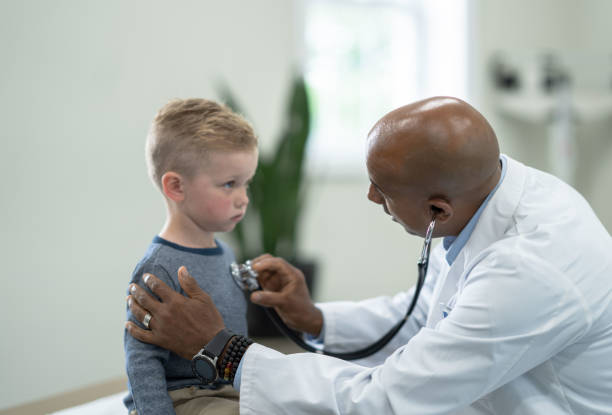 istock Listening to a Little Boys Heart 1353304908