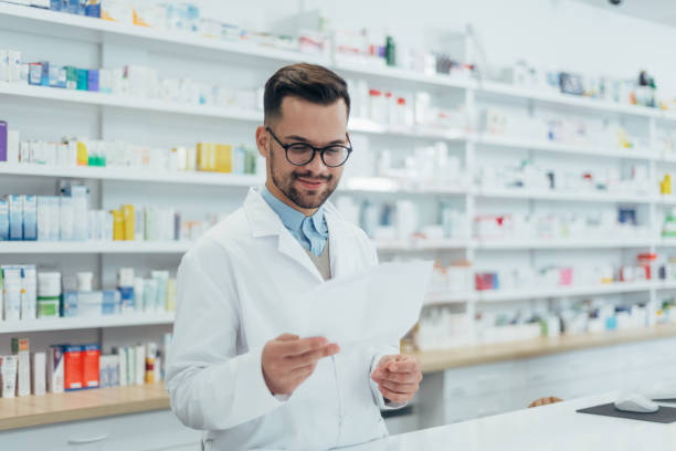 istock Portrait of a handsome pharmacist working in a pharmacy 1353305058