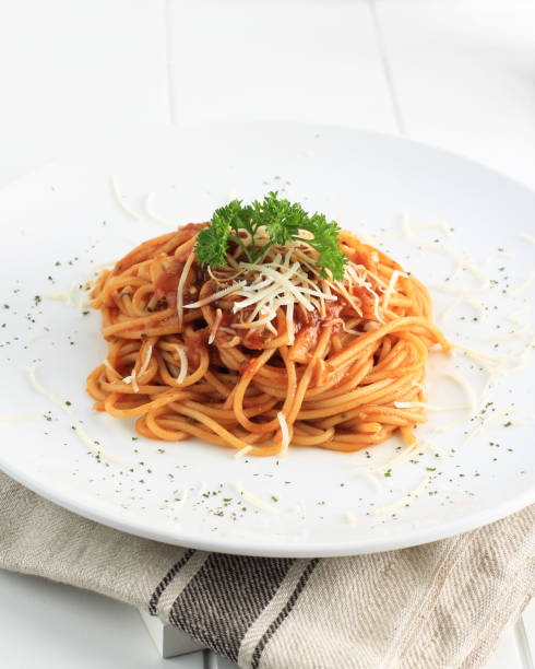 istock Spaghetti Bolognese, Close Up on White Plate, White Background 1353305241