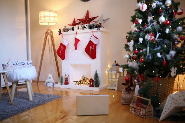 istock Modern design room in light colors decorated with Christmas tree and decorative elements stock photo 1353305908