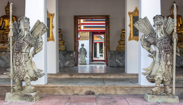 istock Statues and doorway at Buddhist temple 1353311507