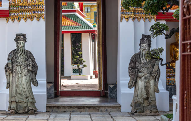istock Statues and doorway at Buddhist temple 1353311531