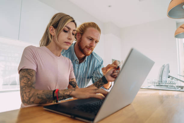 istock Couple uses credit card for online payment 1353316374