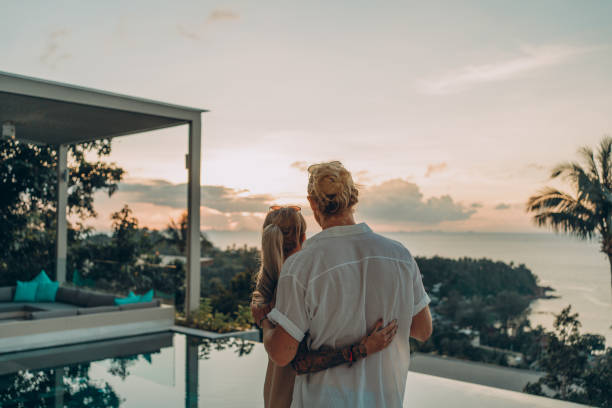 istock Couple in love enjoying the sunset 1353316442