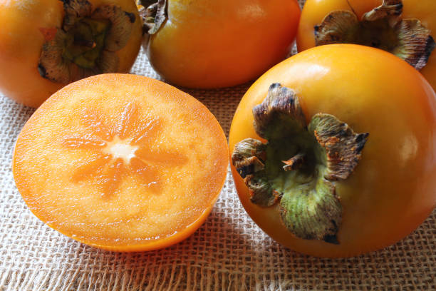istock Persimmon fruit harvest on wooden table 1353321230