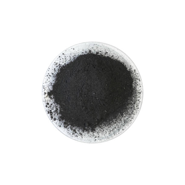 Carbon Charcoal Powder in Chemical Watch Glass. Close up chemical ingredient on white laboratory table. Top View Carbon Charcoal Powder in Chemical Watch Glass. Close up chemical ingredient on white laboratory table. Top View coke coal stock pictures, royalty-free photos & images