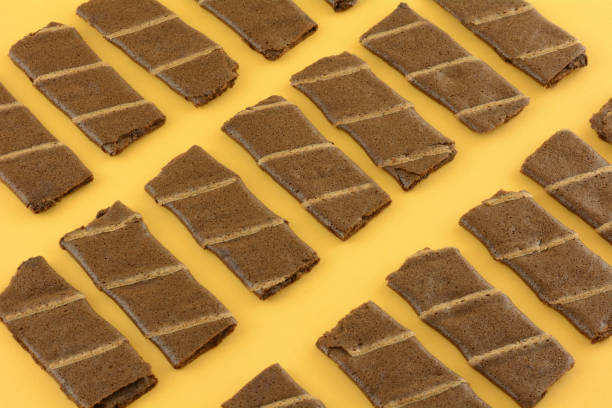 istock Banana and cocoa chocolate wafer roll cookies 1353327539