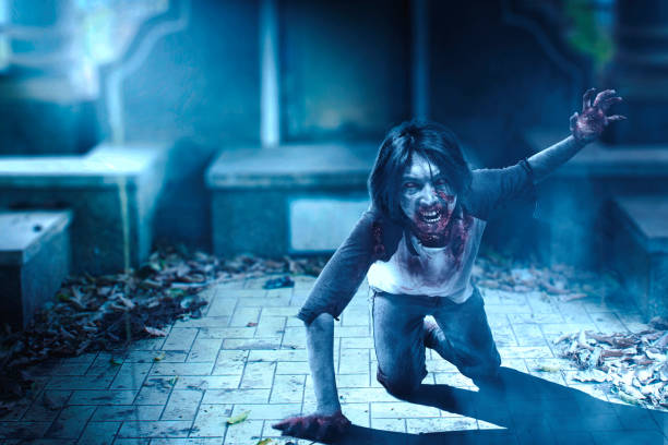 istock Scary zombie with blood and wound on his body crawling 1353330479