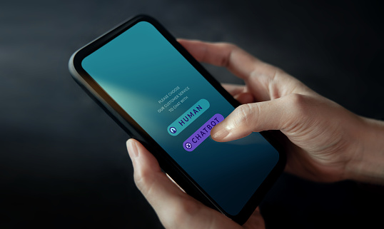 Chatbot, LiveChat Technology Concept. Customer Using Mobile Phone To Make Conversation with an Artificial Intelligence Service. Virtual Assistant for Customer Support Information