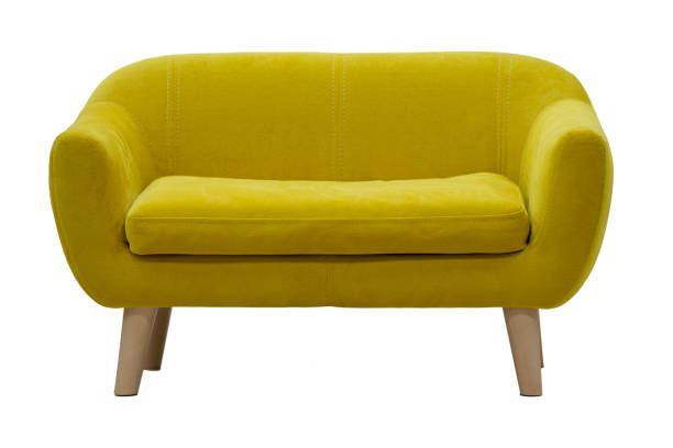 istock Yellow sofa on wooden legs on a white background. 1353340212