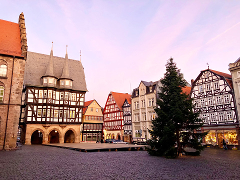 View of Alsfeld town hall, Weinhaus and church on main square, Germany. Historic city in Hesse, Vogelsberg, with old medieval frame half-timbered houses on Christmas time and tree.