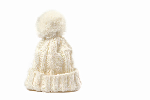 White knitted winter hat on a white background.
