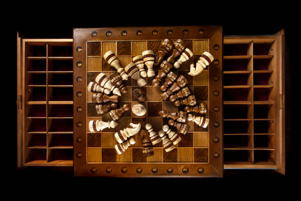 Chess pieces are laid out on a chessboard. A puzzle game with tricky combinations that requires planning and thinking.