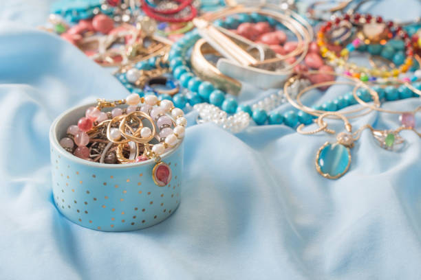 istock different women's jewelry on blue fabric 1353347022