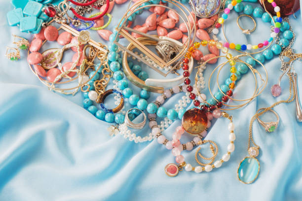 istock different women's jewelry on blue fabric 1353347024
