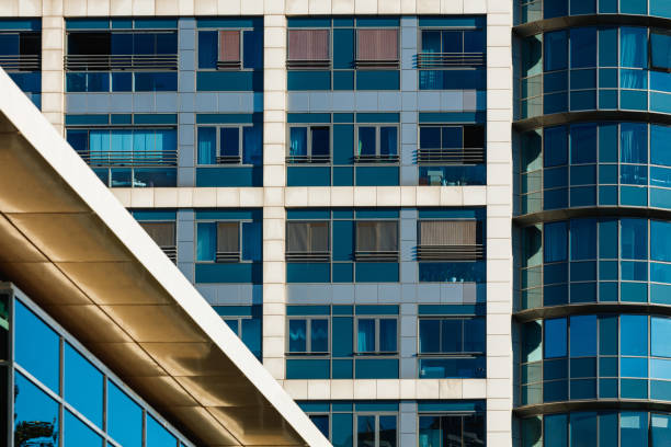istock Modern building facade in glass and concrete, part of square and round segment 1353347832