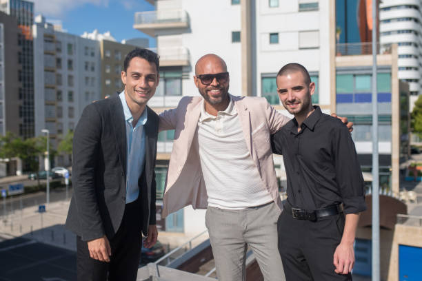 istock Satisfied businessmen on terrace roof 1353349207