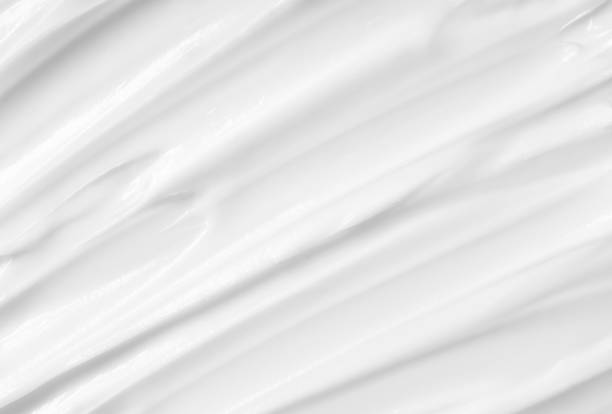 istock Beauty Cream Texture. White lotion, moisturizer, skin care cosmetics application background. 1353349405