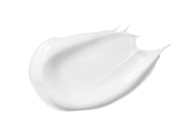 istock White makeup cream sweeps on white background. bb, cc cream texture 1353349410