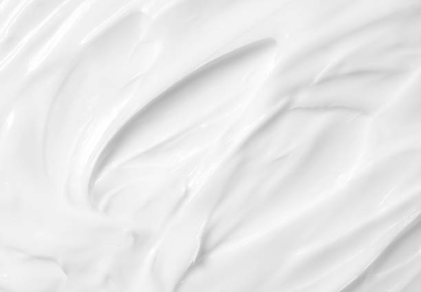 istock Beauty Cream Texture. White lotion, moisturizer, skin care cosmetics application background. 1353349422