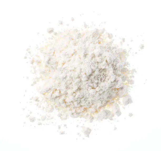 Photo of Flour placed on a white background. View from above.